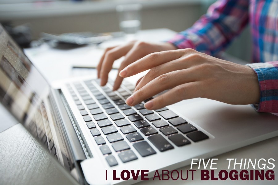 Cropped View of Hands Typing on Laptop